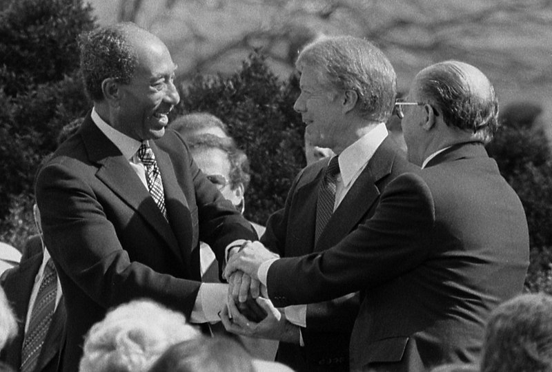 800px-Sadat_Carter_Begin_handshake_(cropped)_-_USNWR