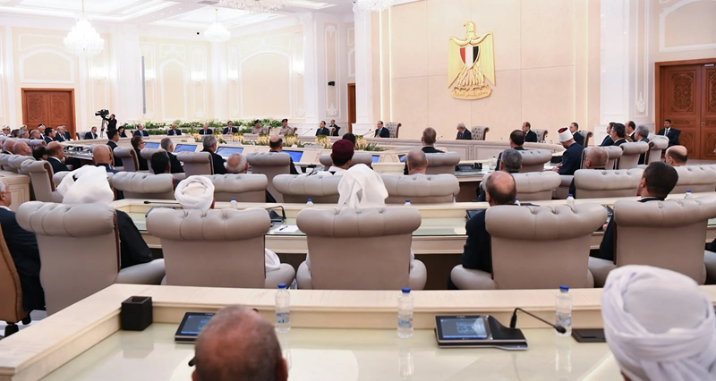 Officials and community representatives attend the expanded meeting