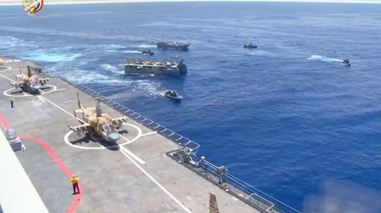 Egyptian anti-mercenary maneuver at strategic western border forces hostile submarines away, takes over beach-head