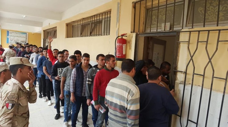 Youth standing in a queue at a polling place in Heliopolis, Cairo. April 21, 2019.

